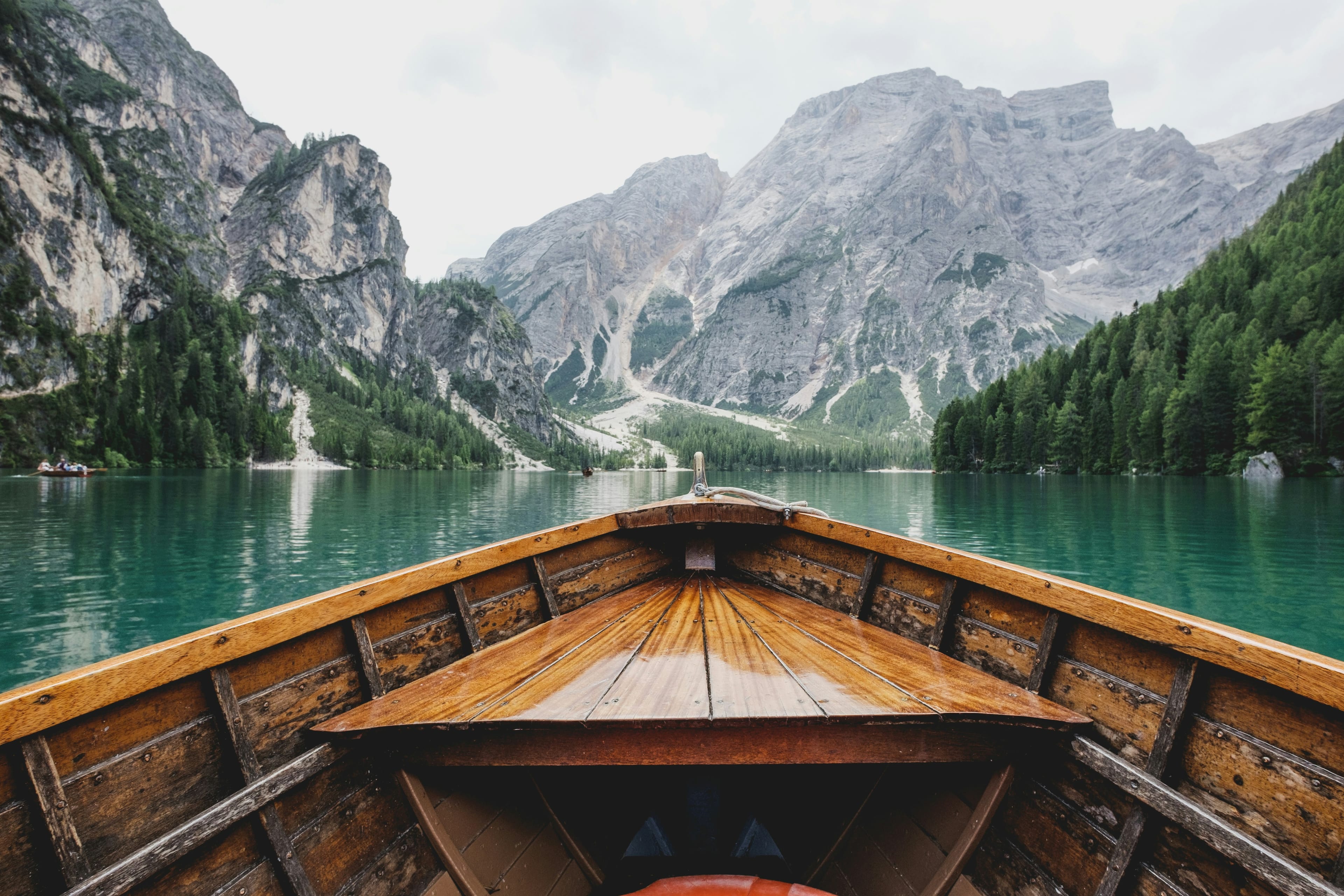 A wooden boat on a mountain lake, the kind of place you travel for